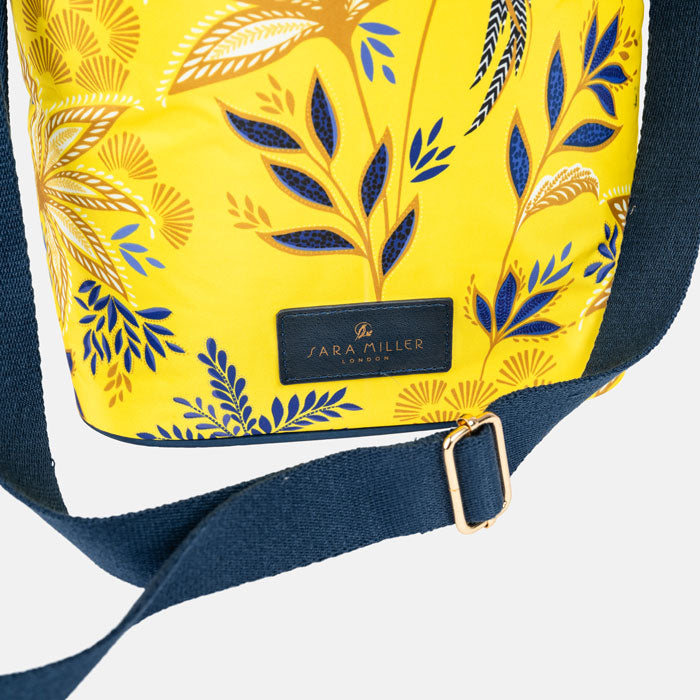 Yellow cooler bag with floral pattern and 'Sara Miller London' label on a white background