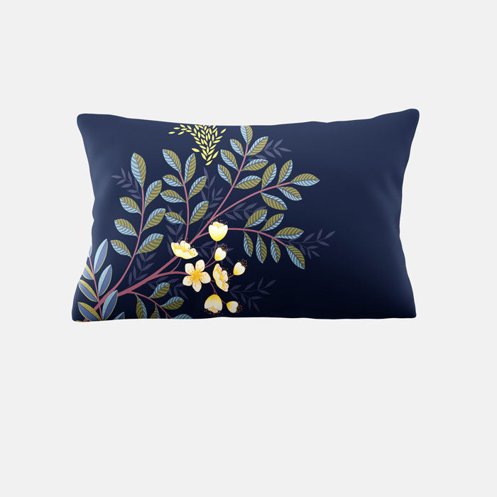 Decorative pillow with floral design on a navy background