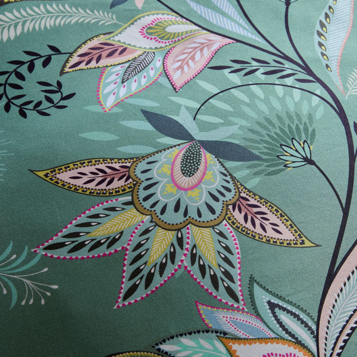 Close-up of a colourful floral pattern on fabric with a green background