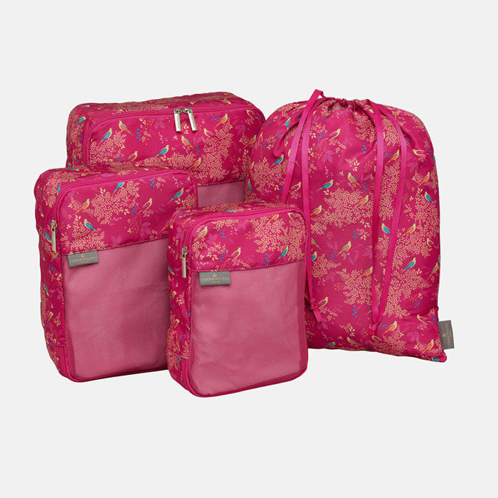 Set of four packing cubes and drawstring bag, shows scale of each.