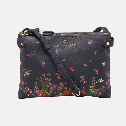 Ditsy floral crossbody bag from the front, white background.