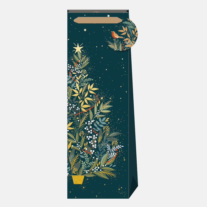 Decorative wine gift bag with festive foliage design on a white background