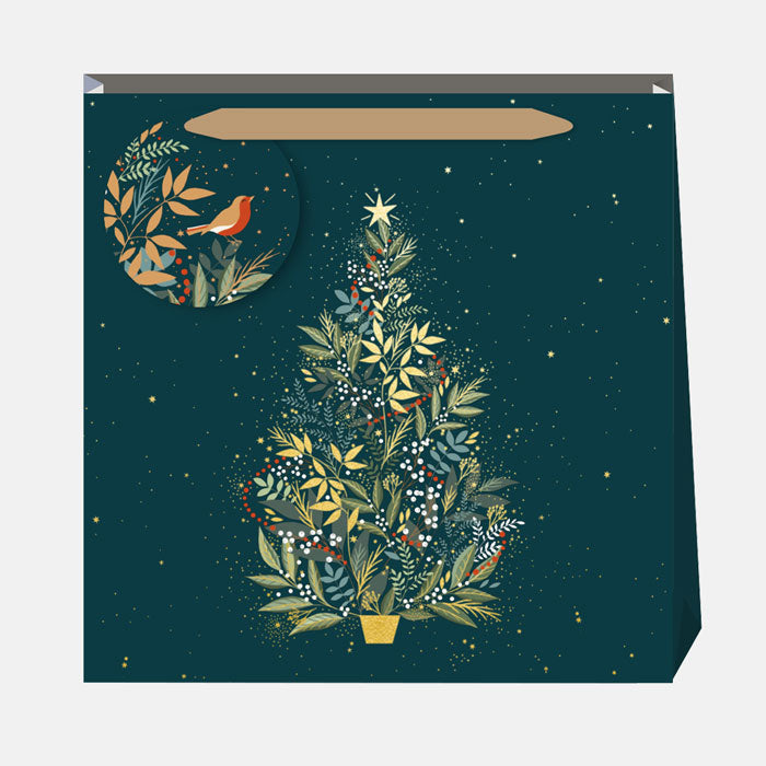 Gift bag with a Christmas tree design on a dark green background