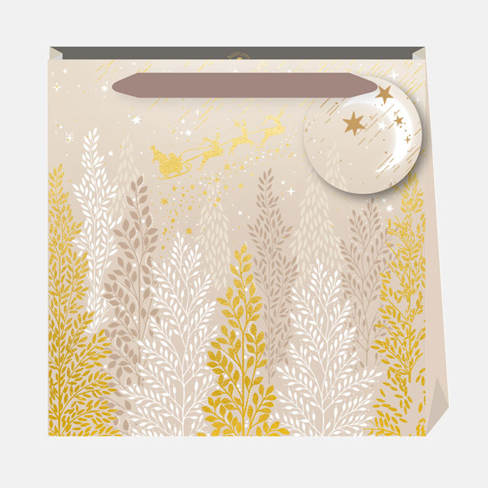 Gift bag with gold and beige leaf pattern on a white background