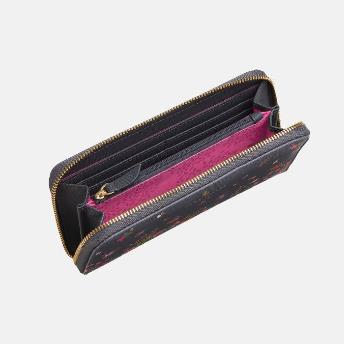 Open purse, can see internal zip pocket and various compartments with pink lining.