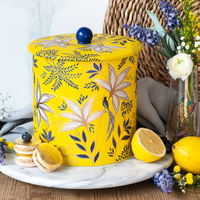 Biscuit barrel in warm yellow colour, with botanic blooms design and gold detailing.