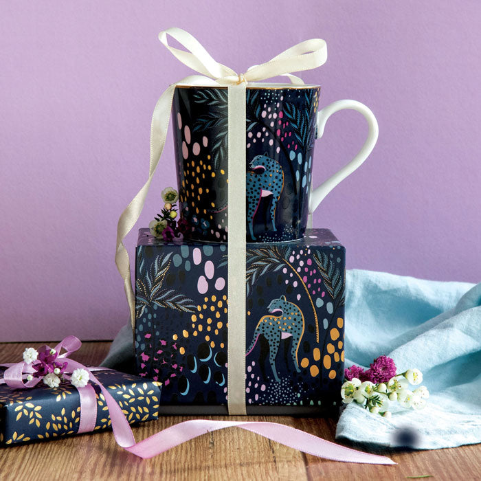 Mug on top of matching gift box with ribbon detail.
