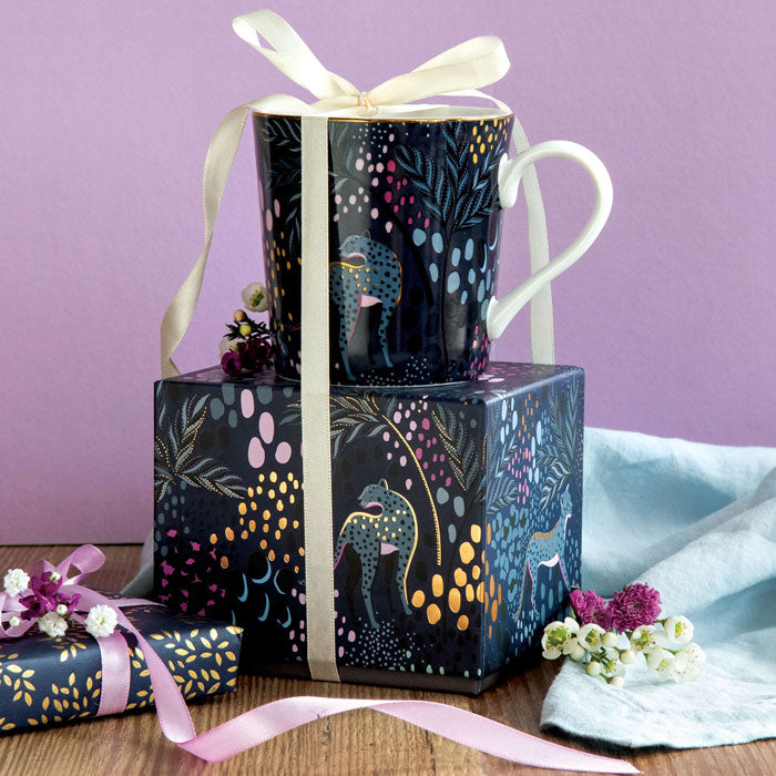 Mug on top of matching gift box with ribbon detail.