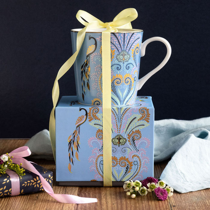 Mug on top of matching gift box with ribbon detail.