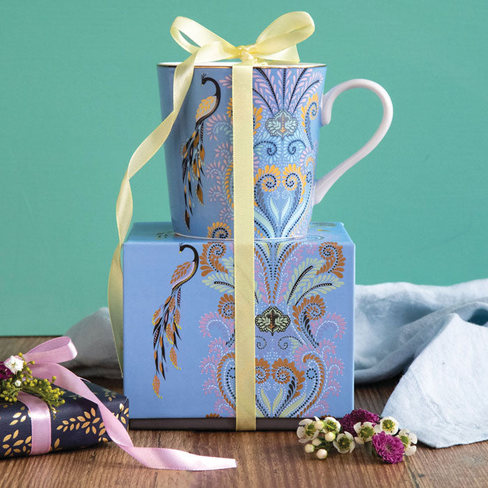 Mug on top of matching gift box with ribbon detail.