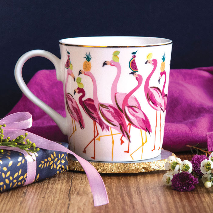 Flamingo mug on coaster. Pink flamingos pattern with fruits.