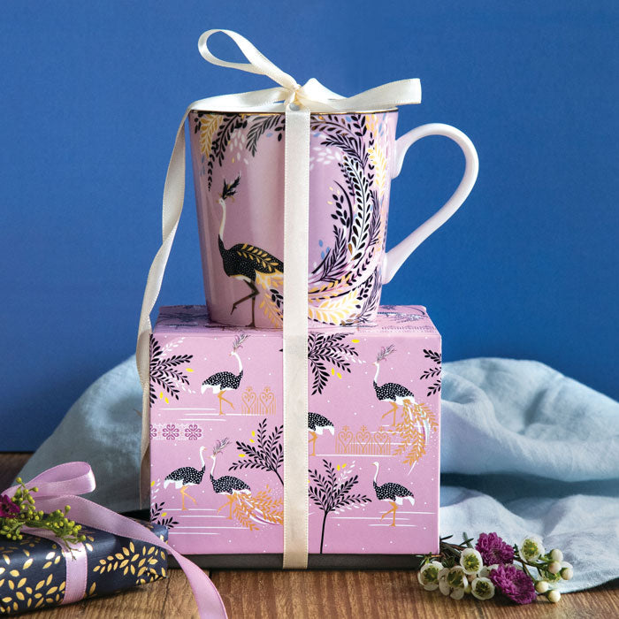 Mug on top of matching gift box with ribbon detail.