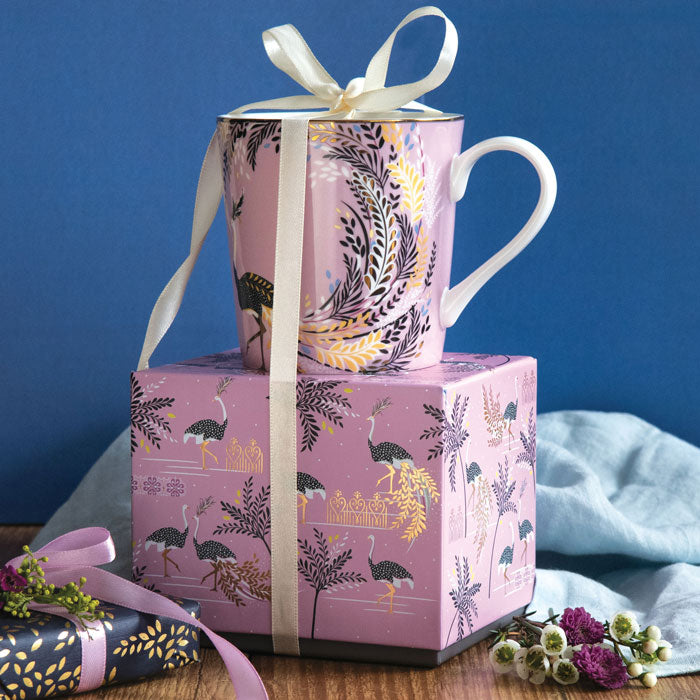 Mug on top of matching gift box with ribbon detail.