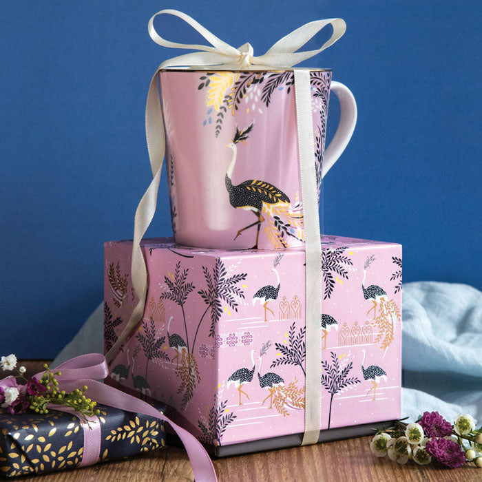 Mug on top of matching gift box with ribbon detail.