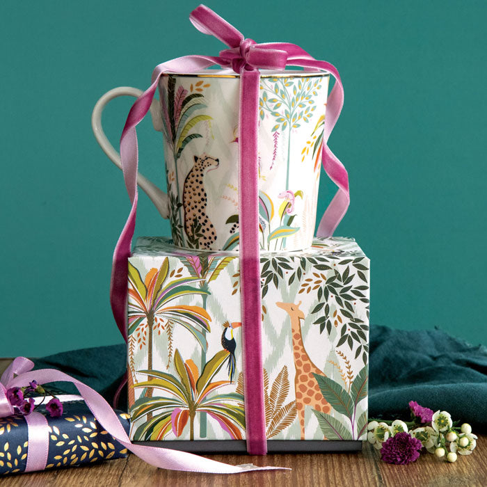 Mug on top of matching gift box with ribbon detail.