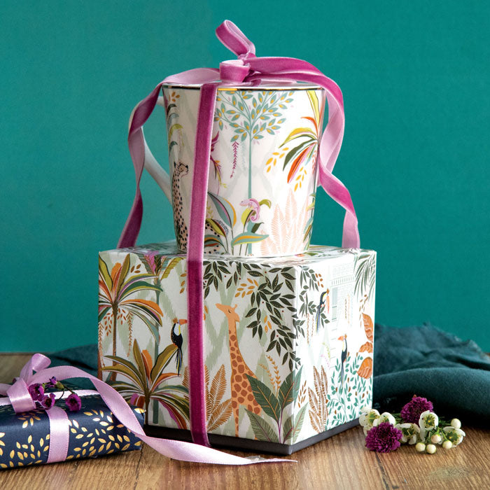 Mug on top of matching gift box with ribbon detail.