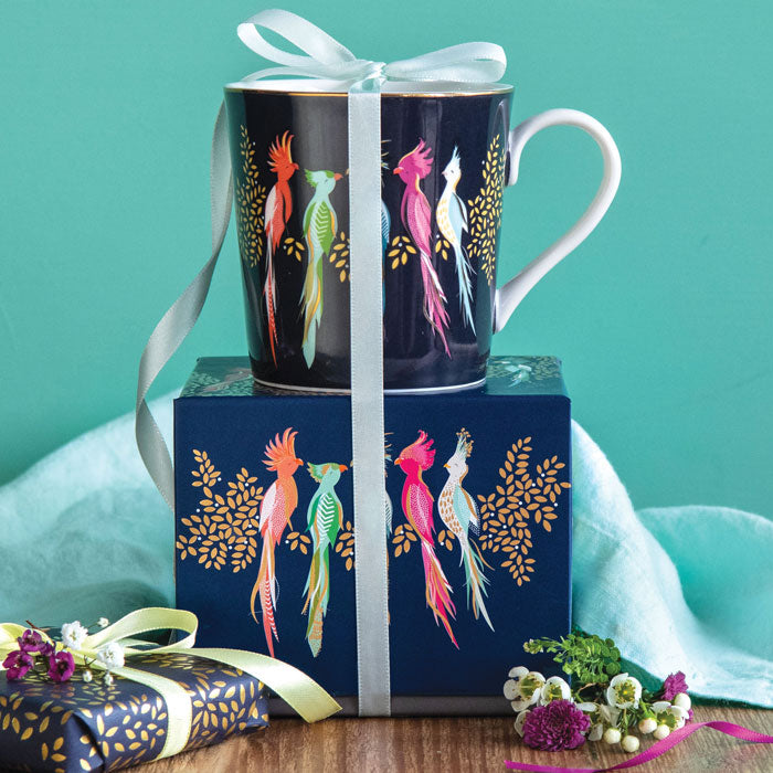 Mug on top of matching gift box with ribbon detail.