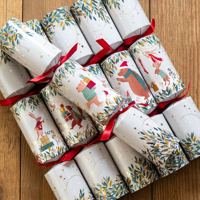 Decorative Christmas crackers with festive designs on a wooden surface