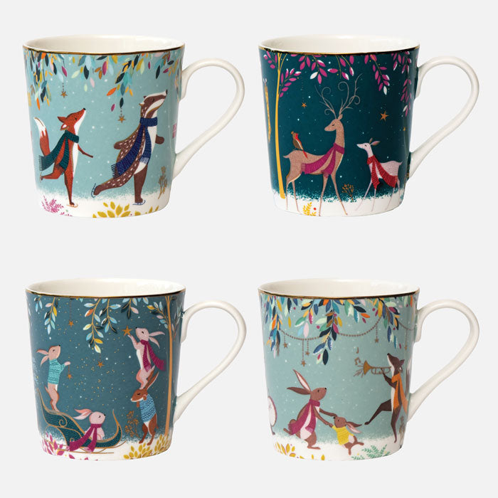 A set of four assorted fine china mugs with whimsical woodland animal designs, including deer, a robin, rabbits, and skaters, with gold embellishments all against different green backgrounds.