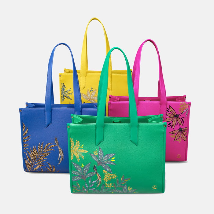 Bags from the same collection all together, in yellow, blue, pink and green.
