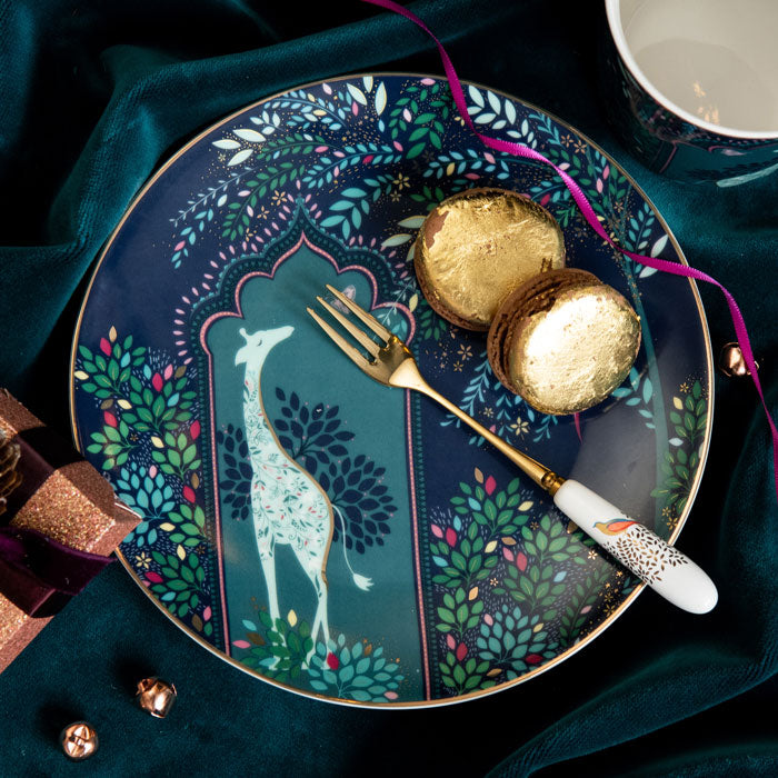 Blue cake plate with giraffe design with gold embellishment.