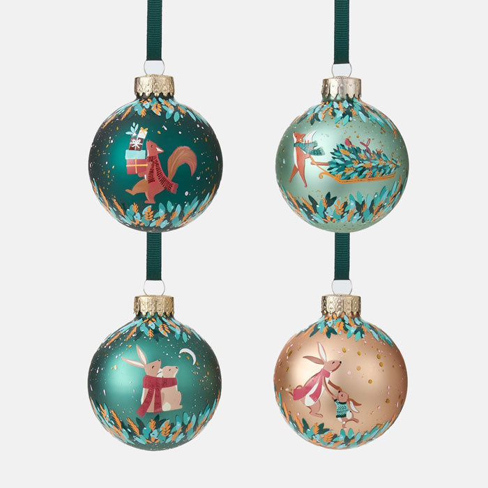 Four decorative Christmas ornaments with animal illustrations on a white background