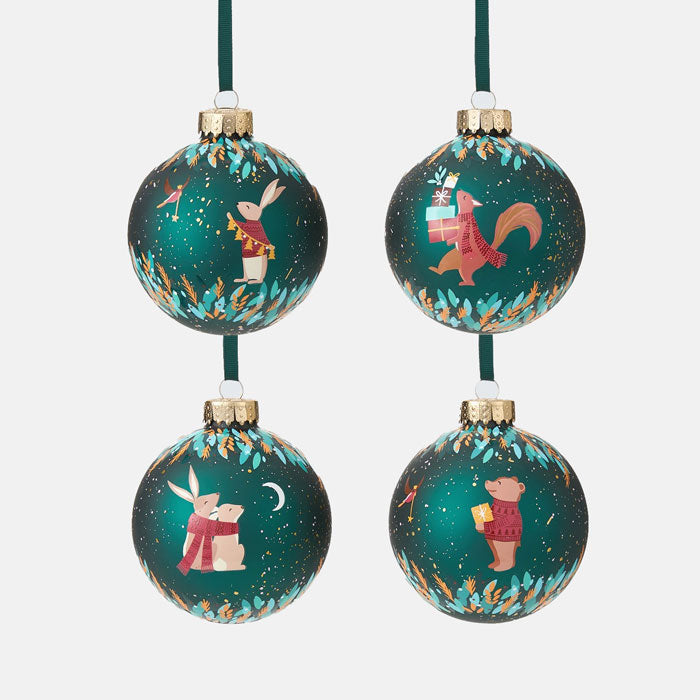 Four green Christmas ornaments with animal illustrations on a white background