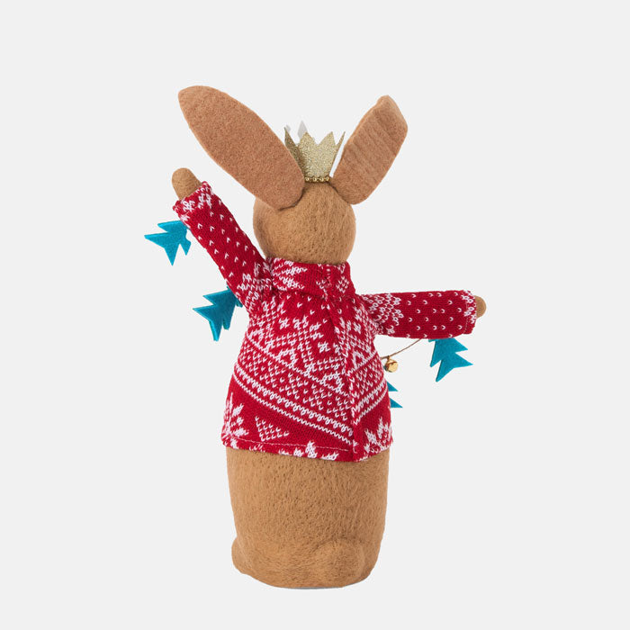Felt rabbit figurine wearing a red sweater with white patterns and a gold crown on a white background