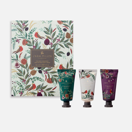 A set of three hand creams in a festive box with winter fig and fern design.