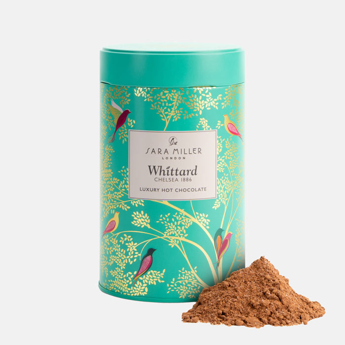 Green Birds container of Sara Miller London Whittard luxury hot chocolate with cocoa powder on a white background