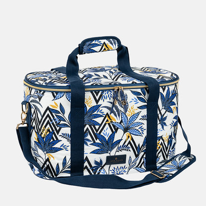 Patterned cooler bag with blue straps on a white background