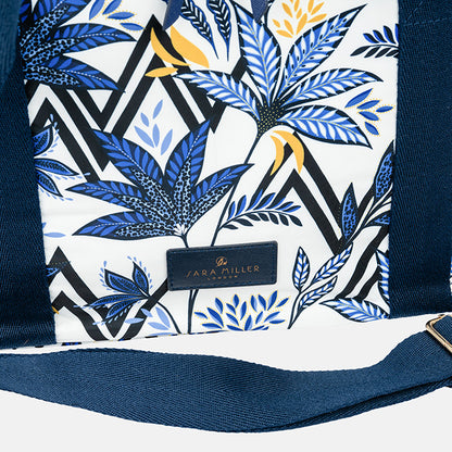 Cooler bag with blue floral pattern and 'Sara Miller London' label.