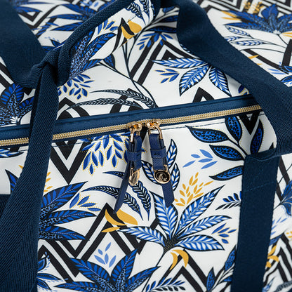 Patterned cooler bag with blue floral design on a white background