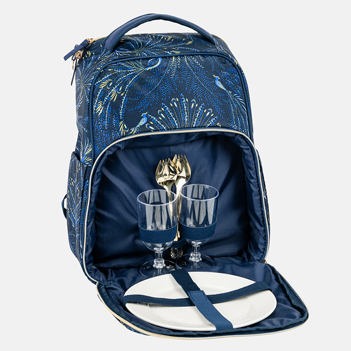 Blue peacock patterned cooler backpack with picnic set inside on a white background