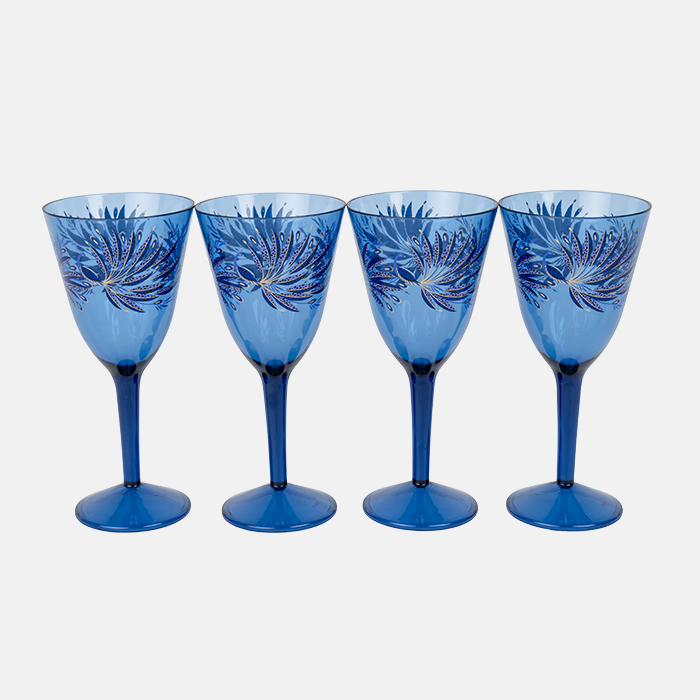 Set of four blue plastic wine glasses with decorative patterns on a white background