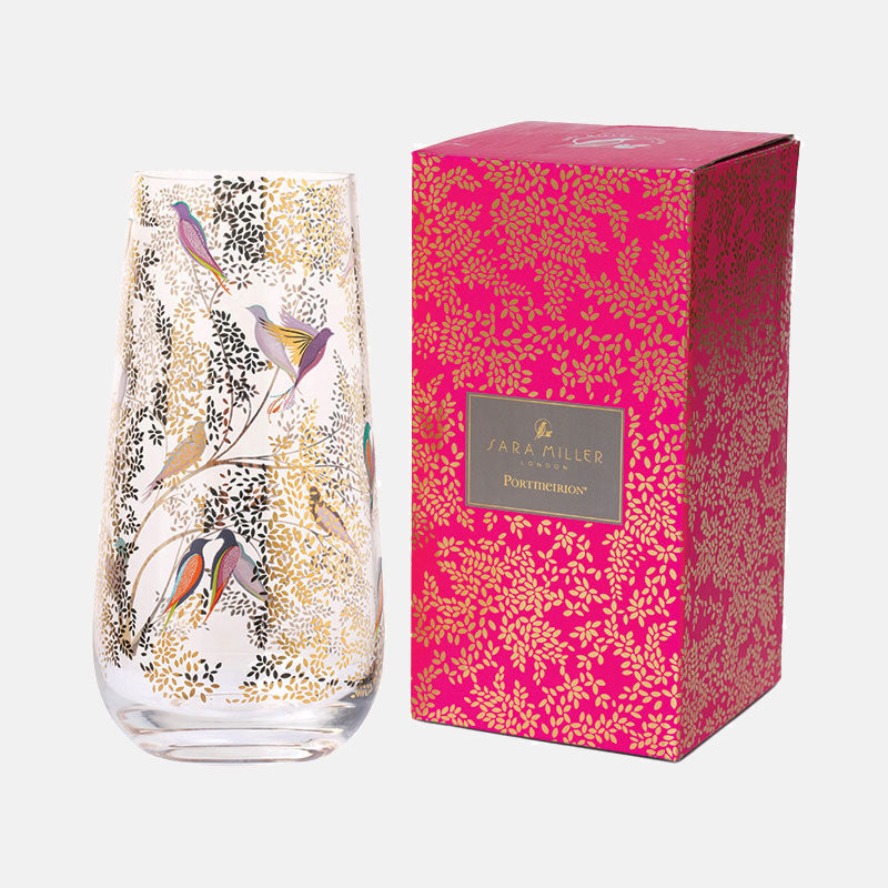 Vase shown next to pink packaging box, similar foliage design on box.