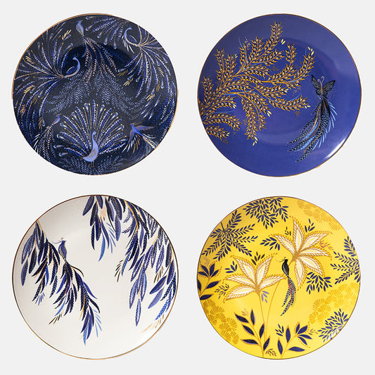 Four decorative plates with floral, bird, butterfly and peacock designs on a white background
