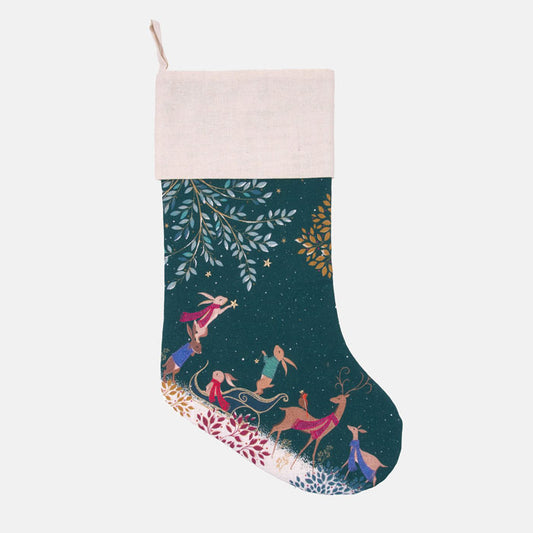 Decorative Christmas stocking with woodland animals decorating the woodland design on a dark green starry background