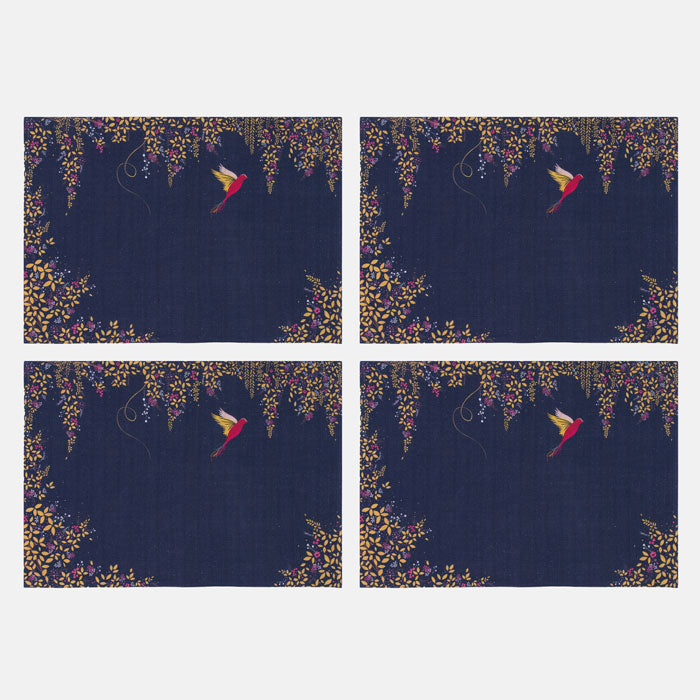 Four identical placemats with a floral design and bird silhouette on a navy background.