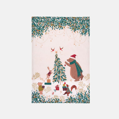 Festive tea towel with bear and woodland creatures decorating a Christmas tree on a cream background.