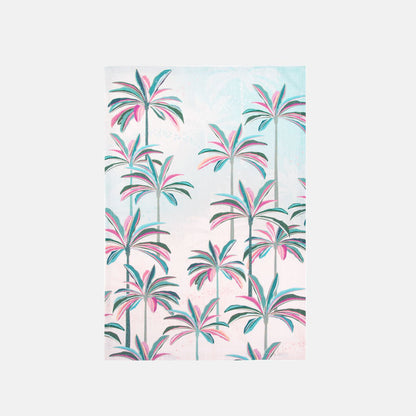 Tea towel with palm trees with pink and green leaves on a light blue background