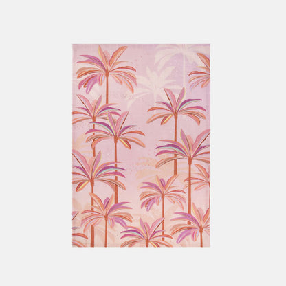 Tea towel with palm tree pattern on a pink background