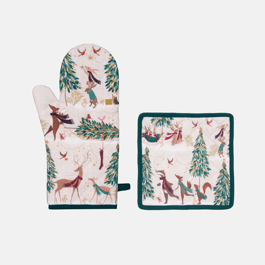 Oven mitt and pot holder set with festive animals and tree design on a cream background