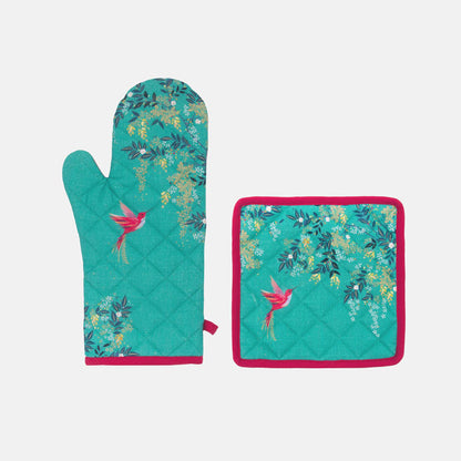 Teal oven mitt and potholder set with floral and bird design on a green background with pink edges