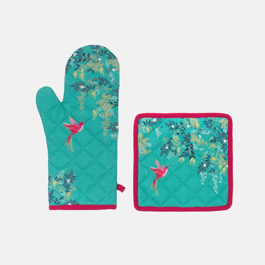 Teal oven mitt and potholder set with floral and bird design on a green background with pink edges