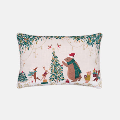 Festive decorative cushion with bear and woodland animals decorating the Christmas tree on a cream background