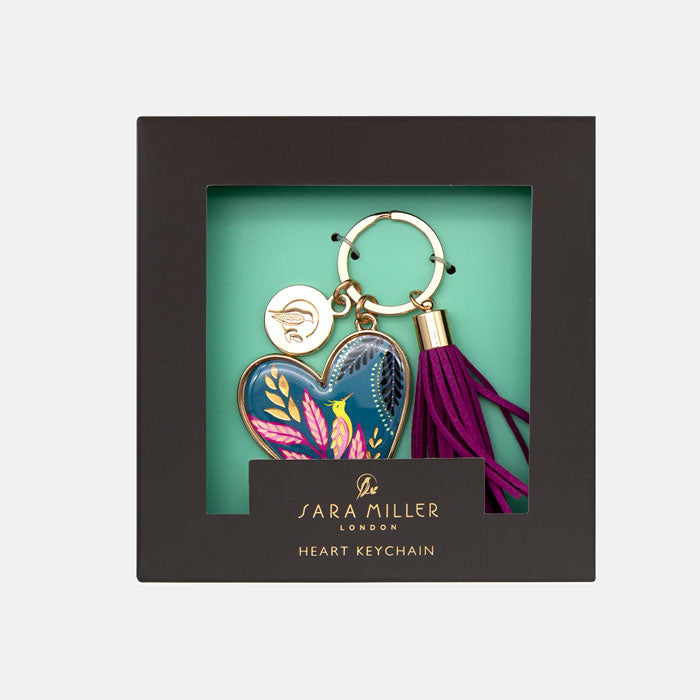 Heart keychain with tassel in a Sara Miller London box on a light gray background