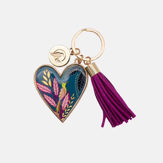 Heart-shaped keychain with floral design and purple tassel on a white background