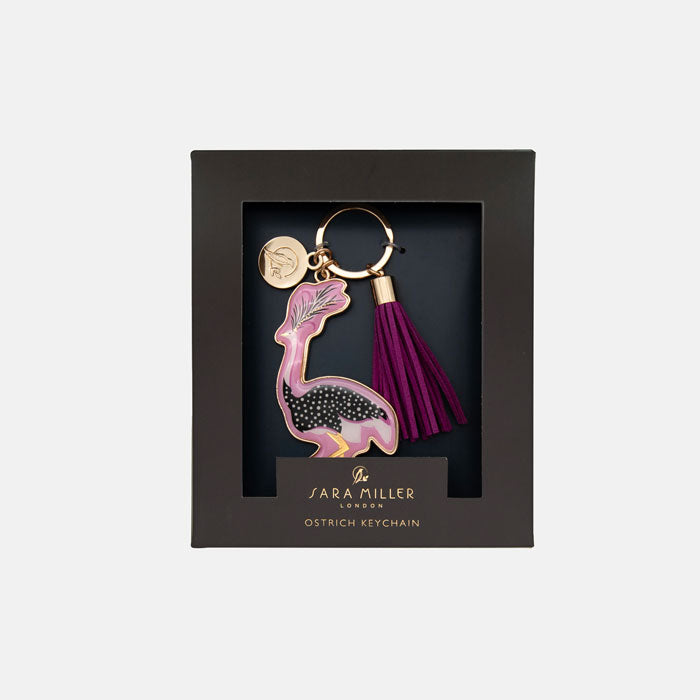 Keychain with ostrich design and tassel in a grey box packaging, featuring the brand 'Sara Miller London'.