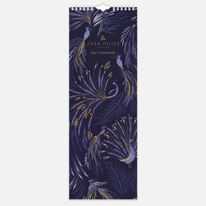 A slim hanging spiral bound wall calendar with intricate blue peacock design on the front with gold embellishment.